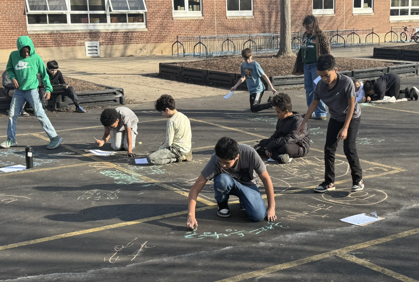kids playing with chalk outside