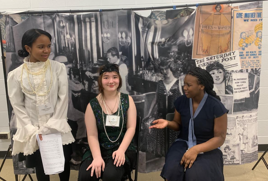 kids in front of a poster 