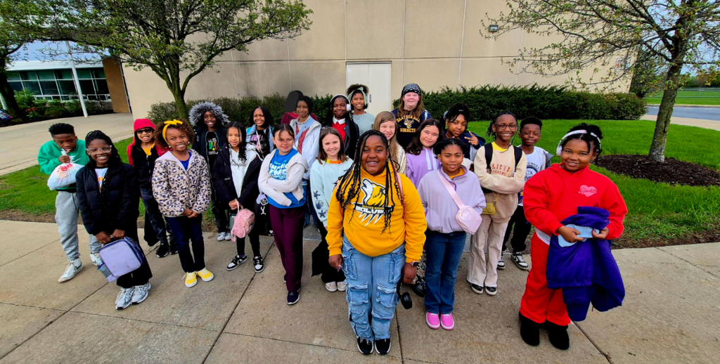 kids standing in front of a building