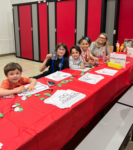 A teacher and student sitting at a table for an activity