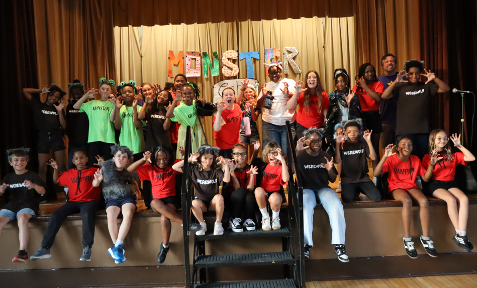 kids in the play posing with monster faces