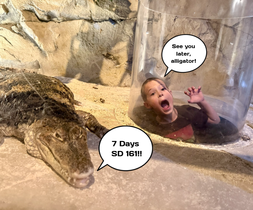 student with an alligator