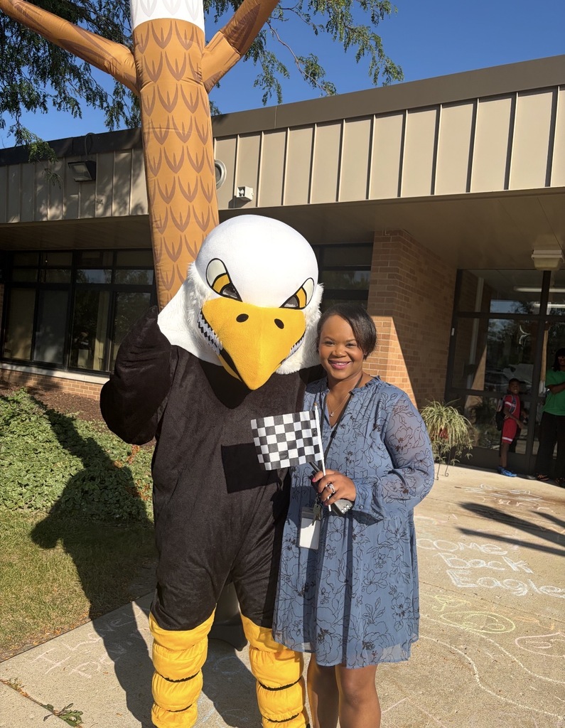 Principal McNeil Dobson and her husband dressed in the eagle costume