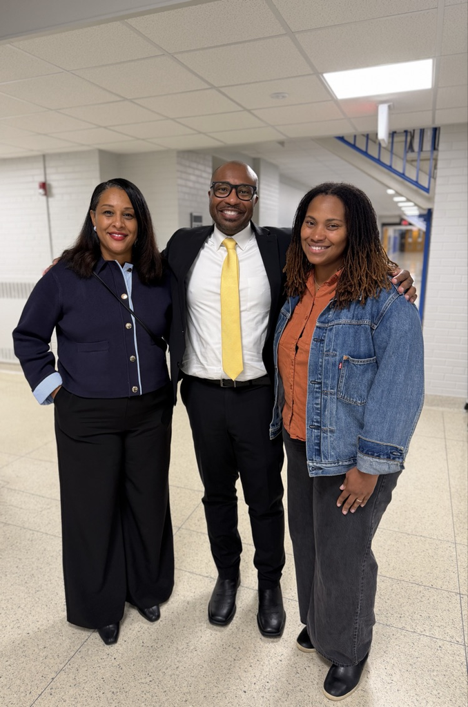 superintendent with staff and parent