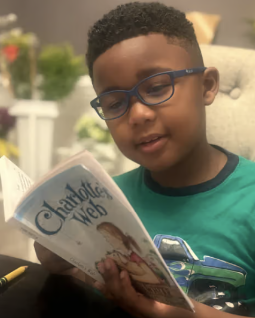 Student reading Charlotte's web.