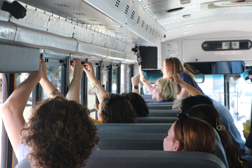 New Flowing Wells teachers ride a school bus during the district’s annual New Teacher Bus Tour.