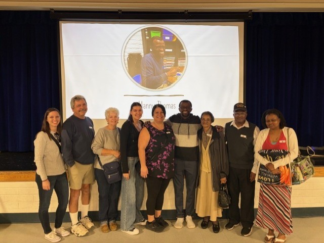 2nd grade teacher, Manny Thomas is celebrated as teacher of the year with his family 