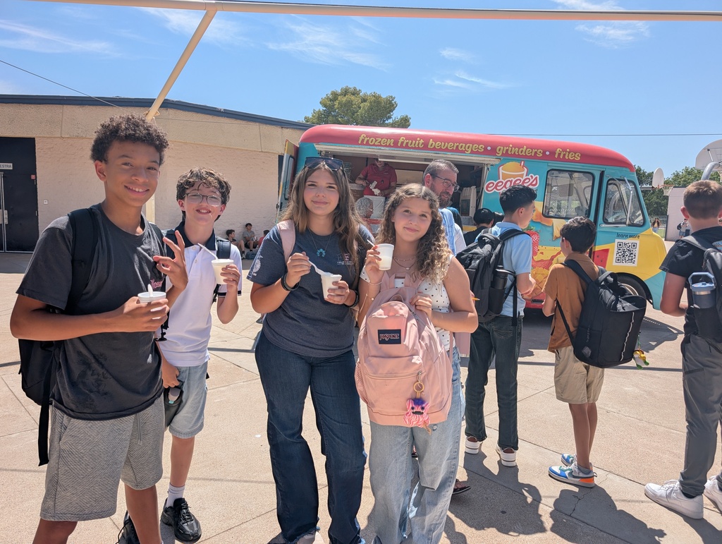 Students outside enjoying a sweet treat