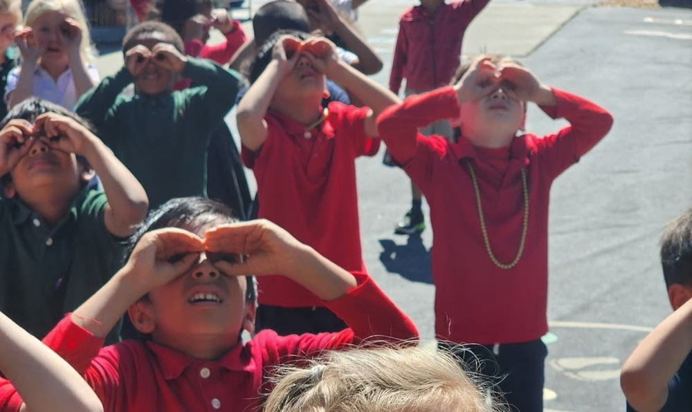 Students looking at sky