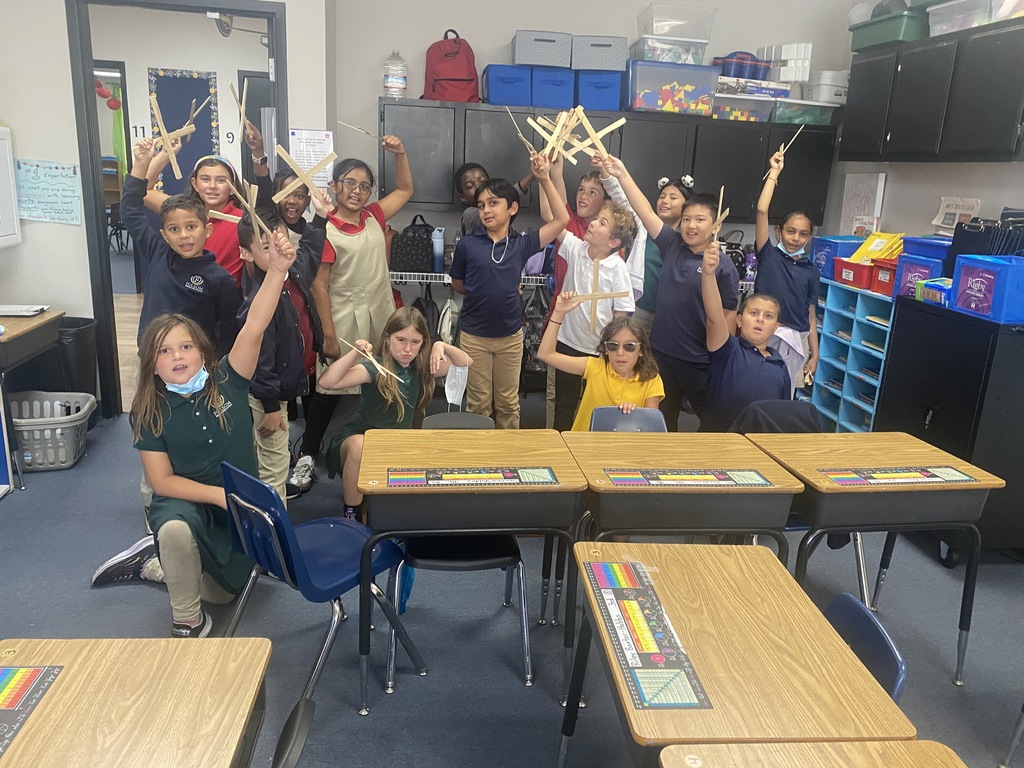 Kids holding up hands