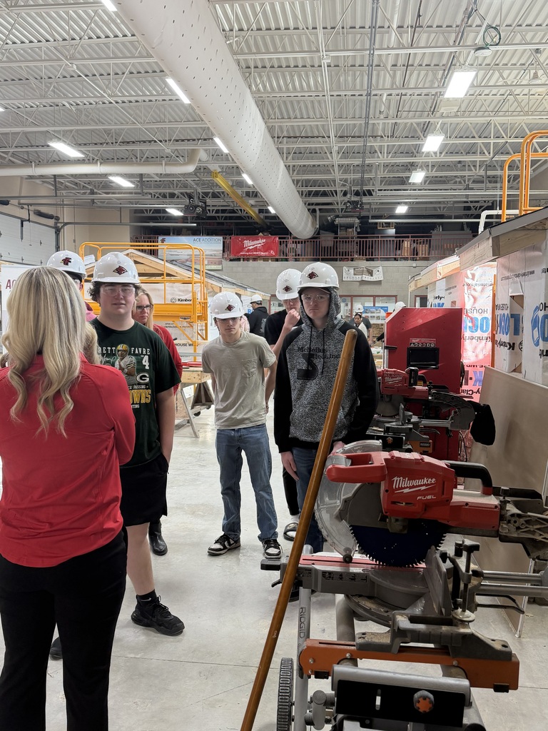 Students networking with Michels representatives in the work space.