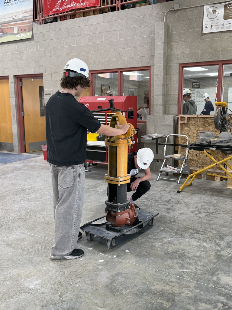 Students using a standing machine.