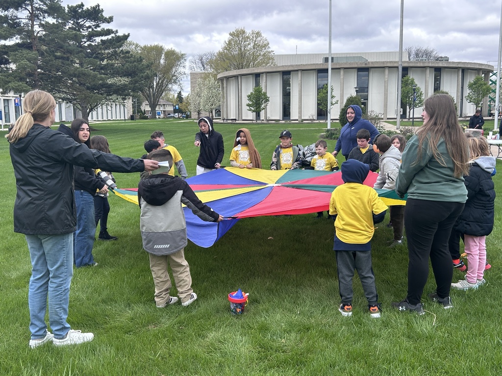 Students with parachute tarp