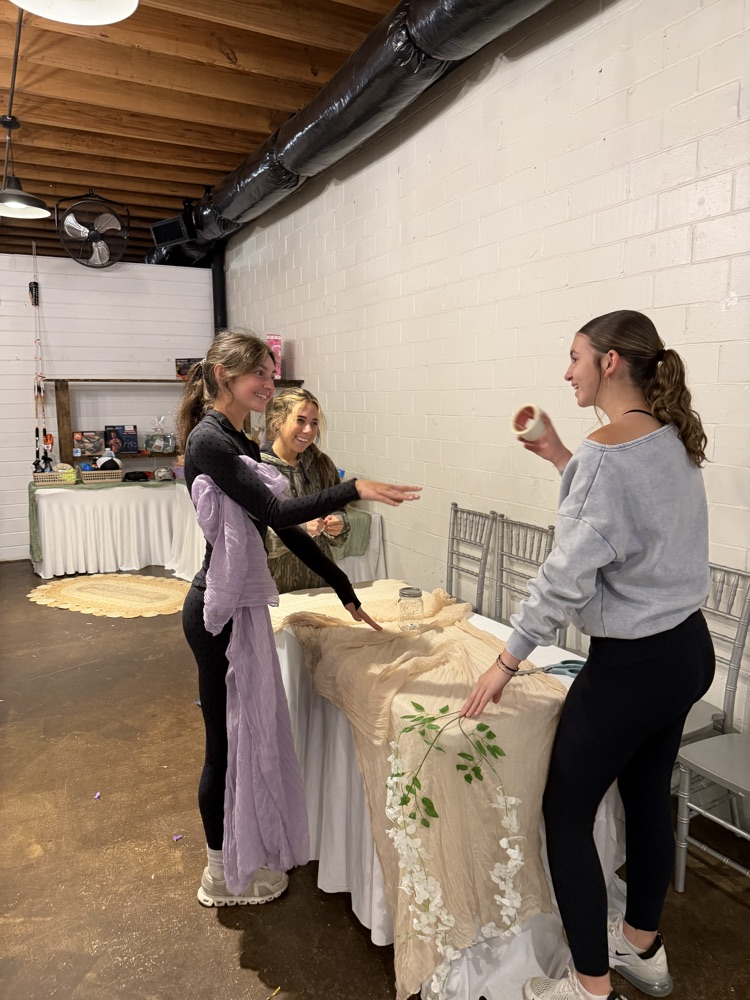 girls decorating a table