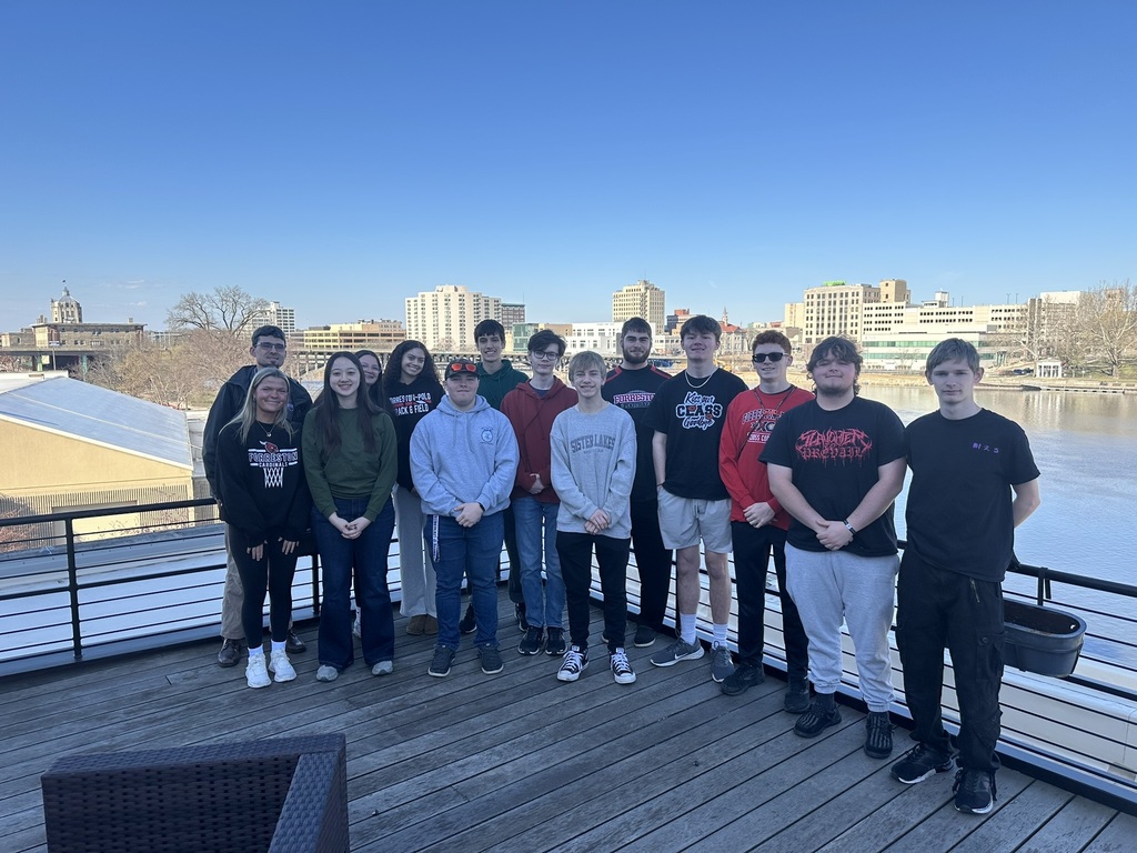 Group photo of the Forreston High School Civil Engineering & Architecture class overlooking the Rock River and downtown Rockford.