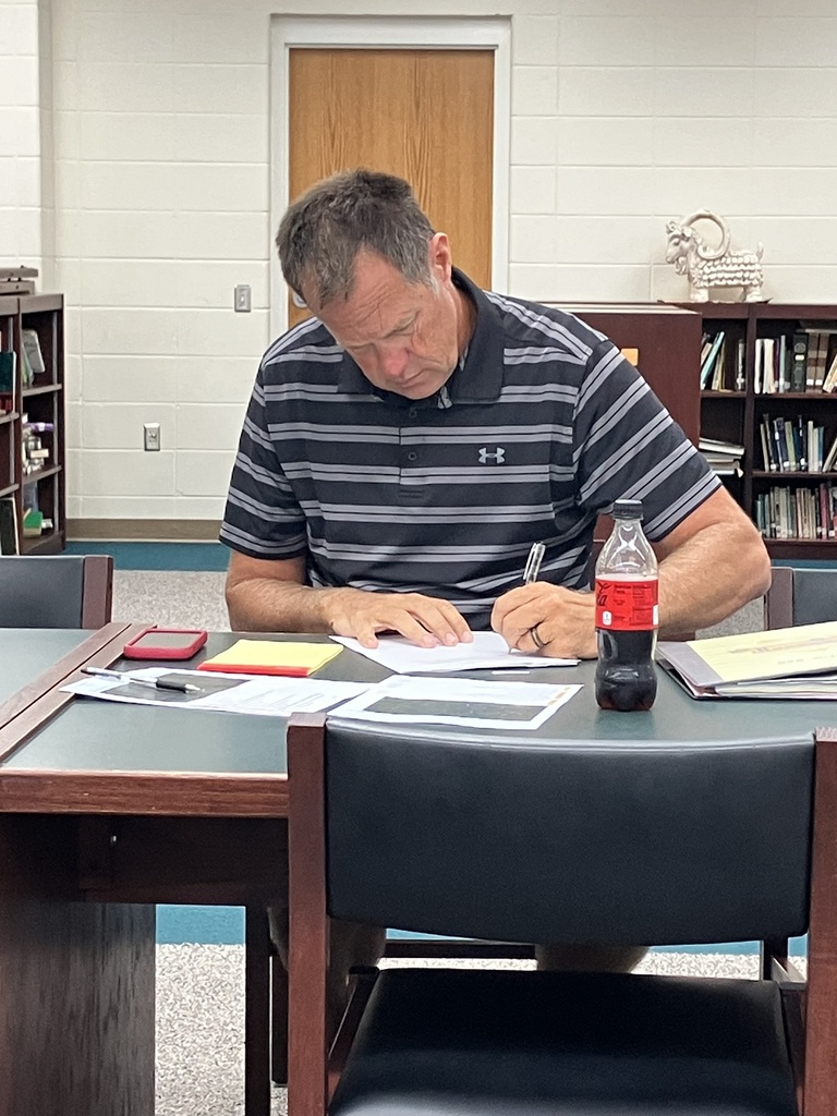 Brent Smith looking over paperwork