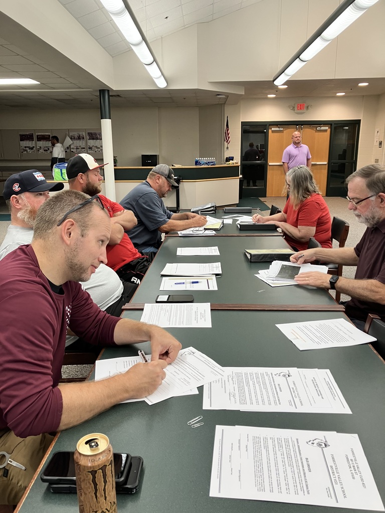 More drivers reviewing paperwork