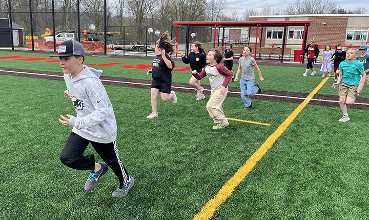 kids running on field