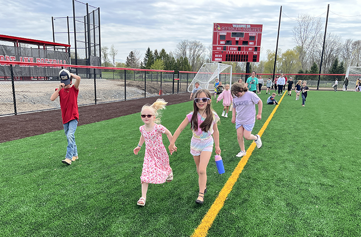 kids running on field