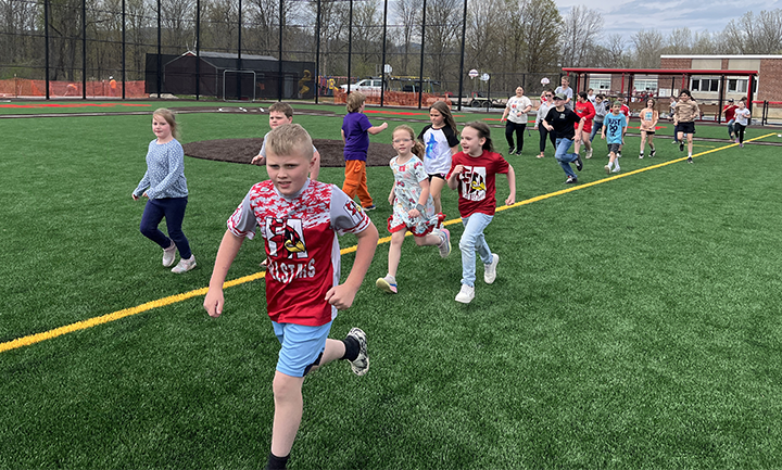 kids running on field