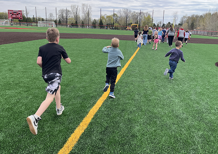 kids running on field