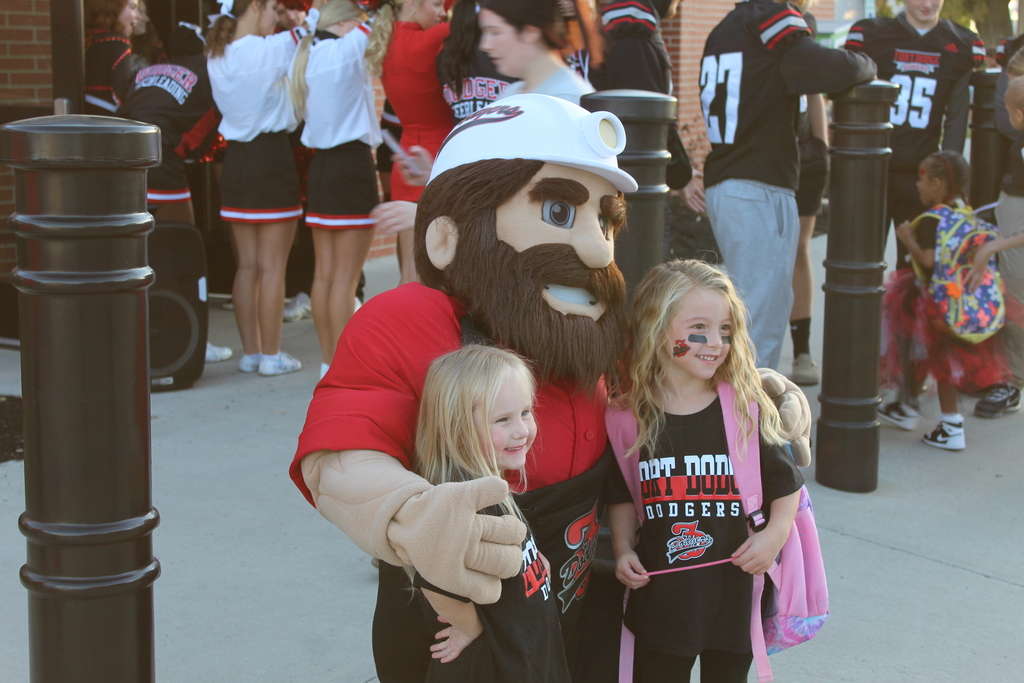 dodger denny smiling with students