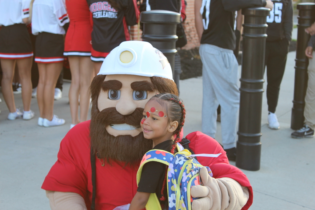 dodger denny smiling with student