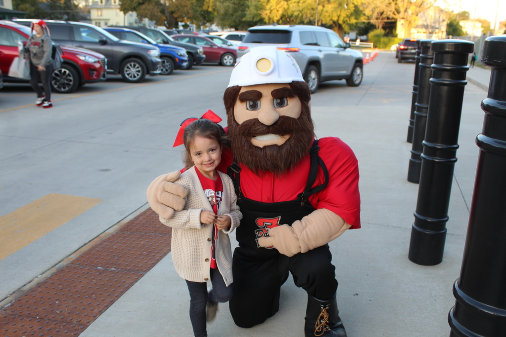 Dodger denny smiling with student