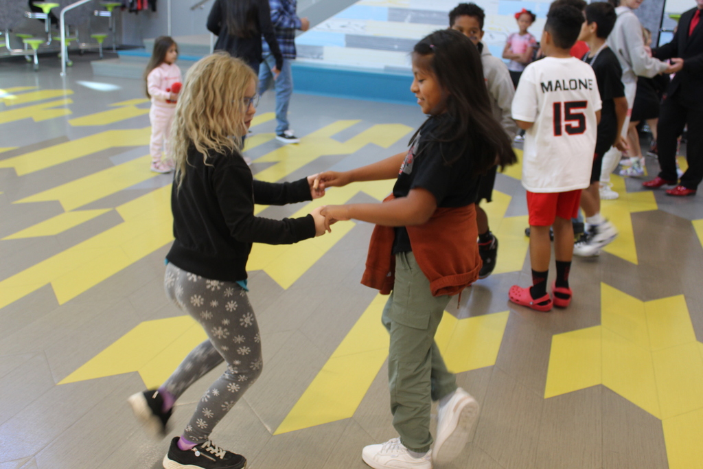 two students dancing together