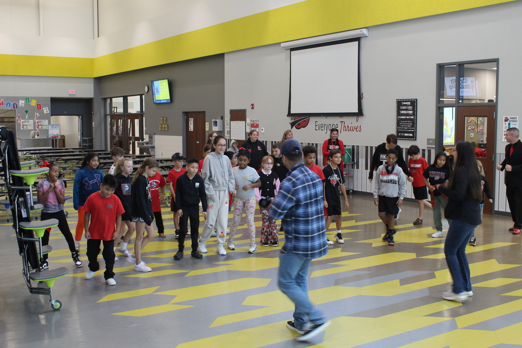 students learning a dance
