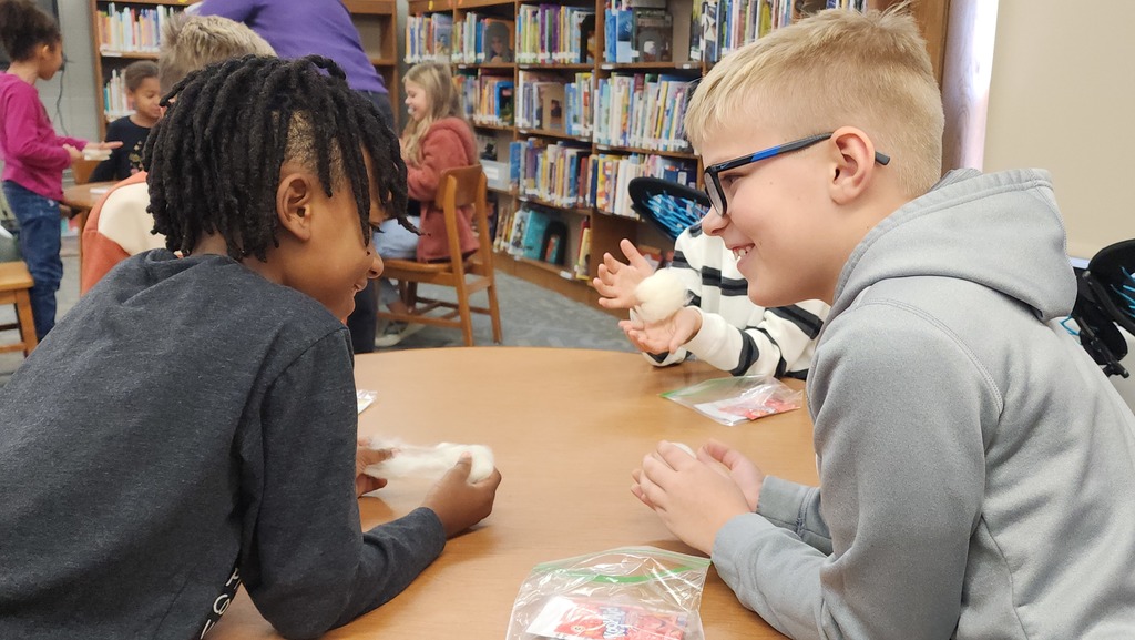 students smiling at each other