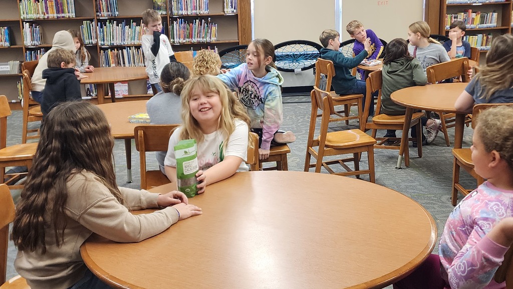 students smiling at each other