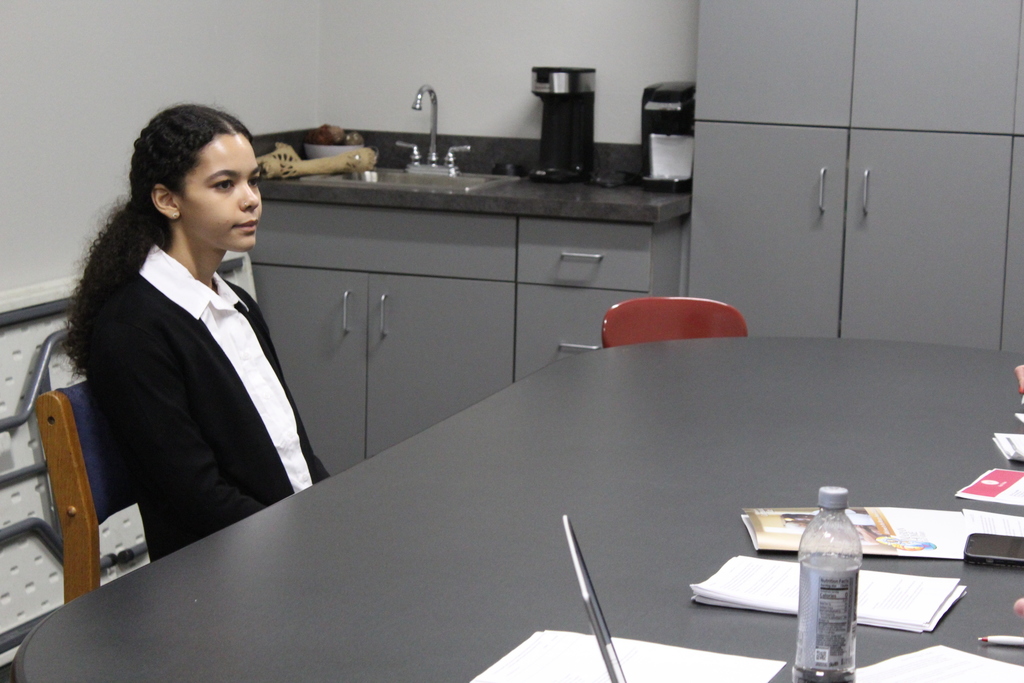 student seated at table
