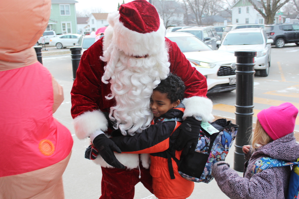 child hugging Santa