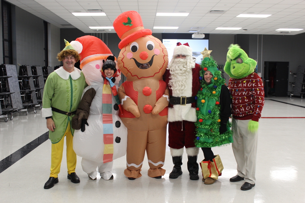 group photo of adults in christmas costumes