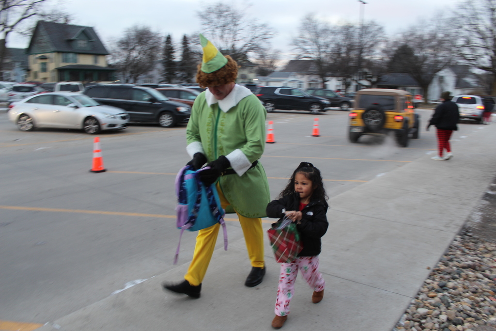 student walking with adult