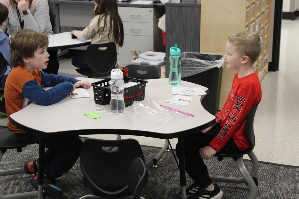 students practicing reading skills