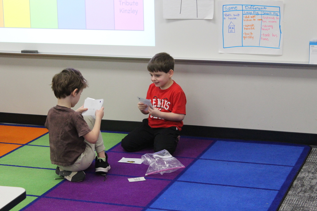 students practicing reading skills