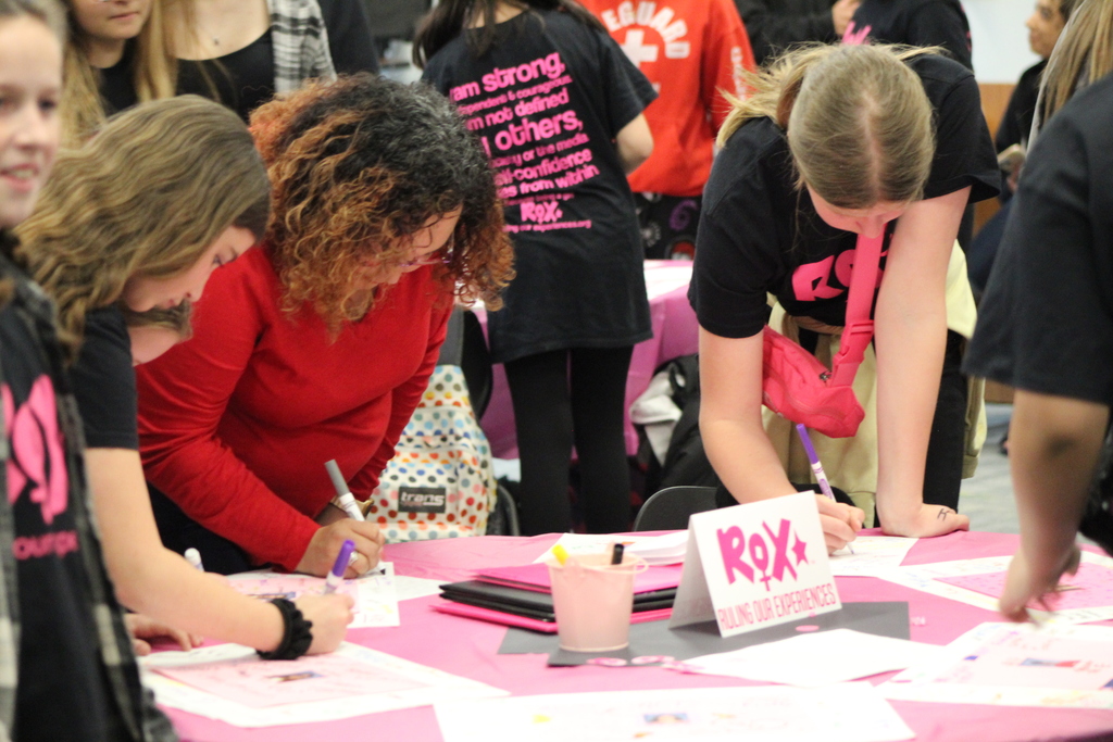 people writing on paper