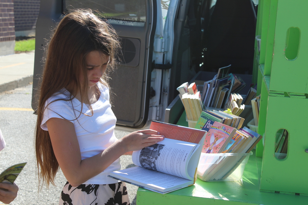 child looking at a book