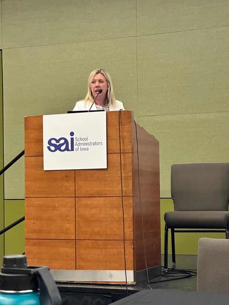 woman speaking at podium