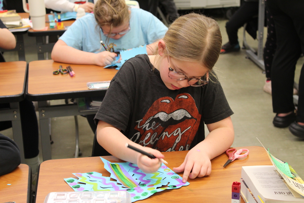 student drawing on an art project