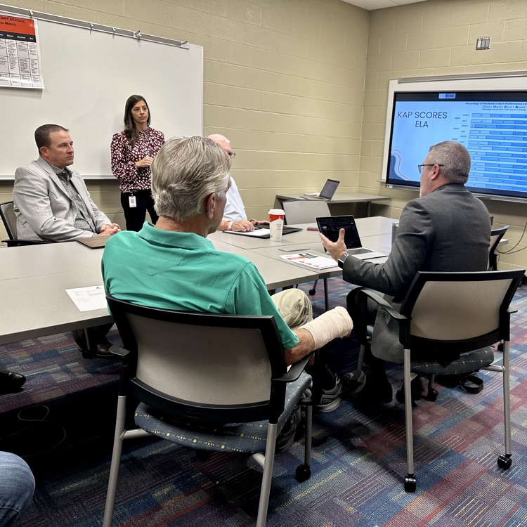 board work session. table discussing ELA state assessment scores