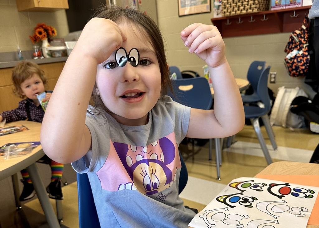 silly girl with stickers on her head!