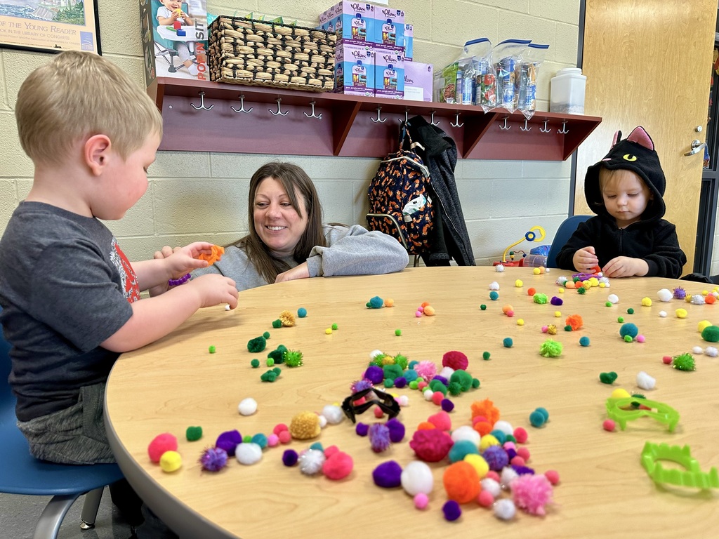playing with pom poms