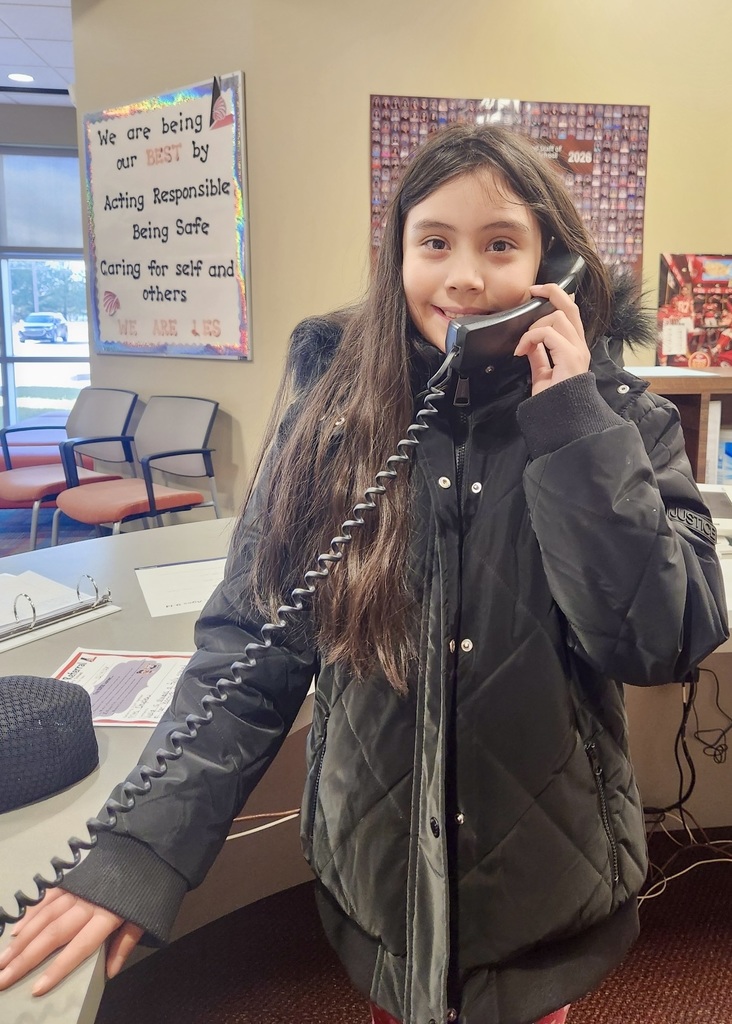 girl in the office making a good news call home