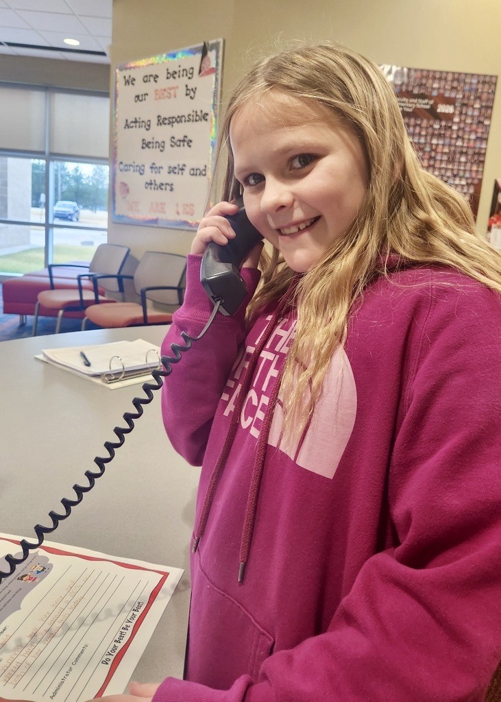 girl in the office making a good news call home
