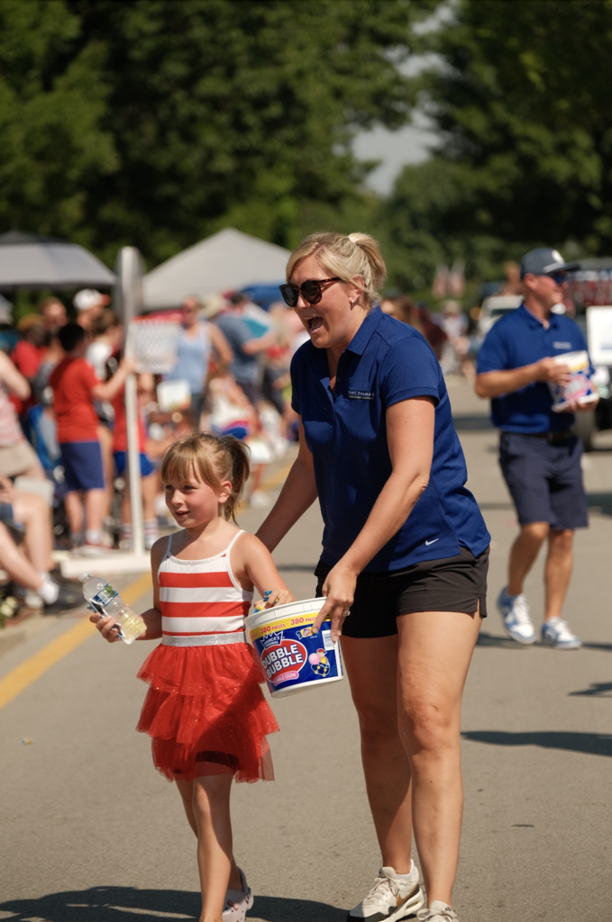 Highlands Middle School principal Erika Volpehein enjoys a moment during the parade.