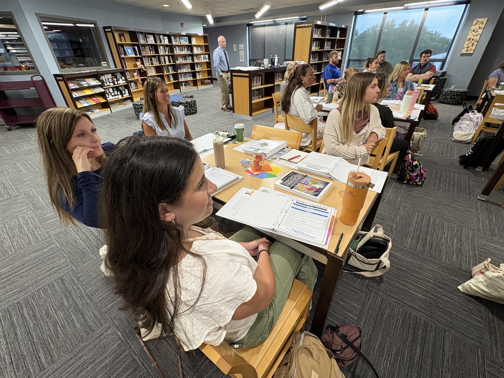Our first-year teachers and staff listen to Mr. Robinson's presentation.