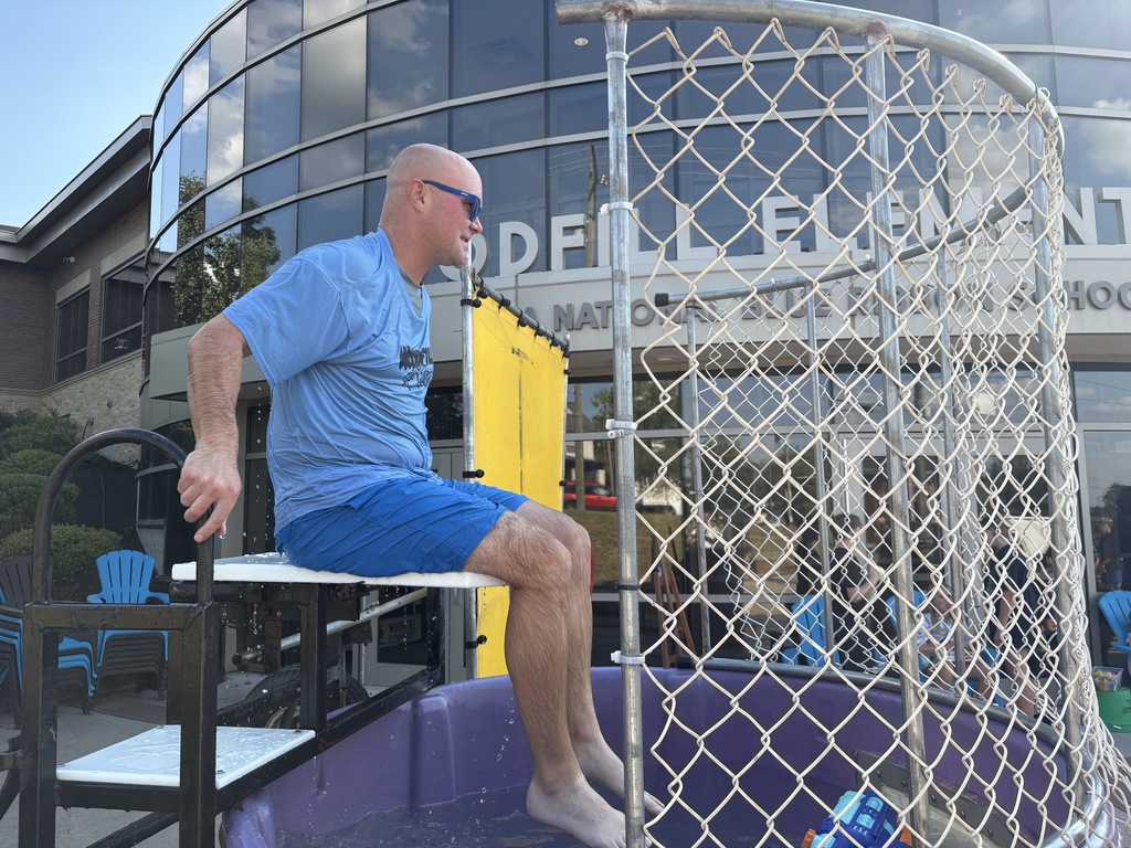 Woodfill principal John Gesenhues takes his turn in the legendary dunk tank.